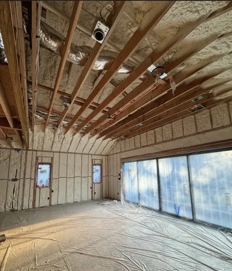 Interior walls and ceiling insulated with spray foam during new construction in Tucson Mountains